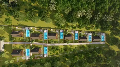 an overhead view of houses in a forest at Redka Bungalov Resort in Ulupelit
