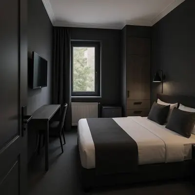 a bedroom with a bed and a desk and a window at Redka Bungalov Resort in Ulupelit