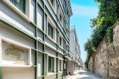a building with a sign on the side of a street at Sistina Old City Hotel in Istanbul