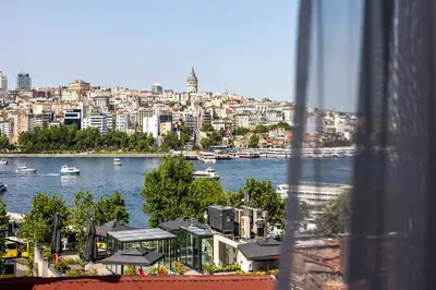 a view of a river and a city with boats at Sistina Old City Hotel in Istanbul