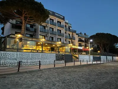 a hotel building with a fence in front of it at Kerpe Askoroz Otel in Kandıra