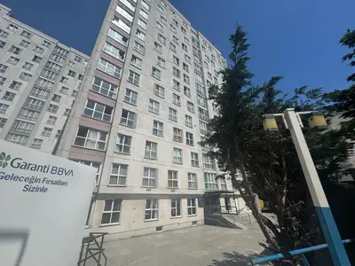 a large building with a sign in front of it at Pin Suite in Buyukcekmece