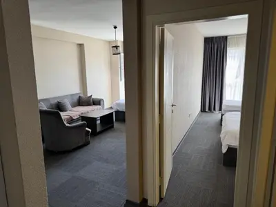 a living room with a couch and a bed at Pin Suite in Buyukcekmece