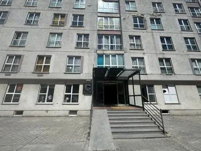 a building with a door and stairs in front of it at Pin Suite in Buyukcekmece