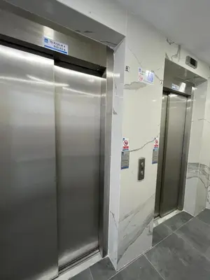 a row of metal elevator doors in a building at Köylüm Bostanci Residence-3 in Istanbul
