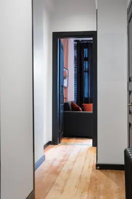 an open door into a living room with a couch at Charming 1BR Flat with Balcony in Cihangir in Istanbul