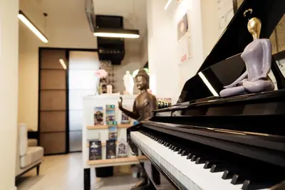 a mannequins sitting on a piano in a store at Magnova Studios in Istanbul