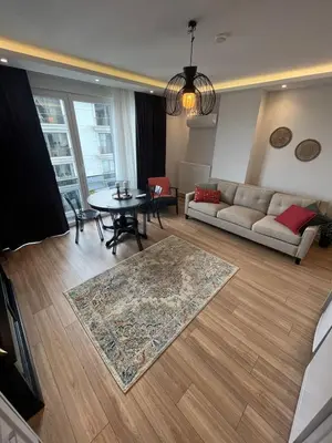 a living room with a couch and a table at Suadiye Bostanci Luxury 2 Bedroom Apartment with Pool in Istanbul