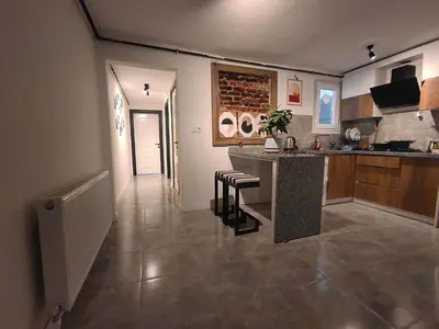 a kitchen with a counter and stools in a room at charming apt with fast WİFİ and AC near Nişantaşi and Taksim#5 in Istanbul