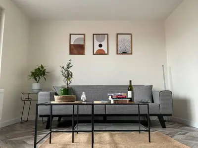 a living room with a couch and a table at charming apt with fast WİFİ and AC near Nişantaşi and Taksim#5 in Istanbul
