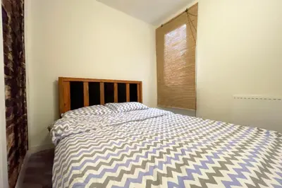 a bedroom with a bed and a window at charming apt with fast WİFİ and AC near Nişantaşi and Taksim#5 in Istanbul