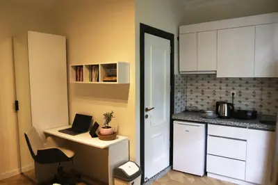 a kitchen with a laptop computer on a desk at balcony 2BR apt with 2toilet and 2bath near to nişantaşi #3 in Istanbul