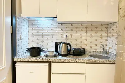 a kitchen counter with a coffee maker and a sink at balcony 2BR apt with 2toilet and 2bath near to nişantaşi #3 in Istanbul