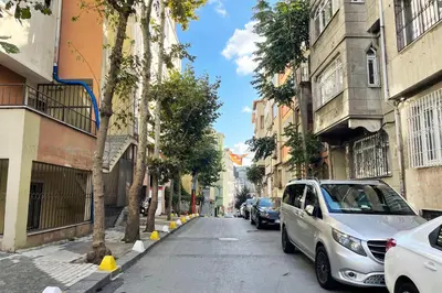 a city street with cars parked on the street at balcony 2BR apt with 2toilet and 2bath near to nişantaşi #3 in Istanbul