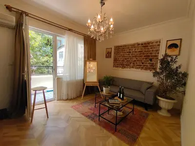 a living room with a couch and a table at balcony 2BR apt near to nişantaşi #2 in Istanbul