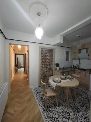 a kitchen and dining room with a table in a room at balcony 2BR apt near to nişantaşi #2 in Istanbul