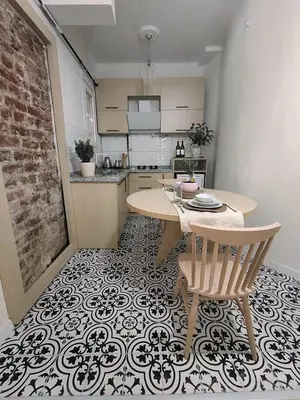 a kitchen with a table and a table and chairs at balcony 2BR apt near to nişantaşi #2 in Istanbul