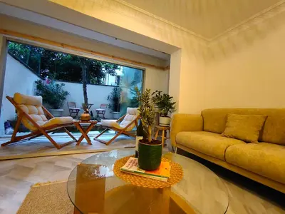 a living room with a couch and a glass table at baesment 2BR apt with 2toilet and 2bath 8min to metro #1 in Istanbul
