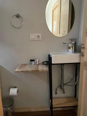 a bathroom with a sink and a mirror at Pink Home 4 in Istanbul