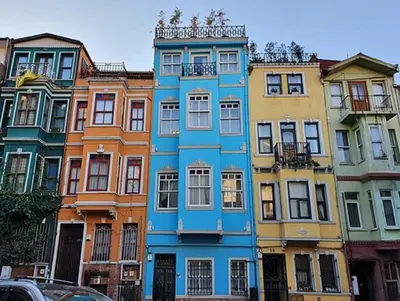 a blue building in front of a group of buildings at Pink Home 4 in Istanbul