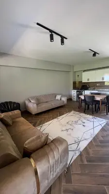 a living room with two couches and a piano at Kocaeli Başiskele Doğayla İç İçe Özel Havuzlu Tatil Evi in Bahçecik