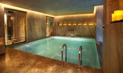 a swimming pool with two faucets in a room at Berjer Boutique Hotel & Spa in Istanbul