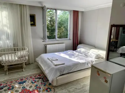 a small bedroom with a bed and a window at forest villa, breakfast hotel, 6 minutes from Istanbul airport in Arnavutköy