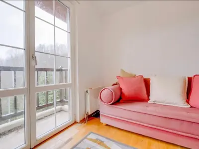 a living room with a red couch and a window at Villa Sapanca in Sapanca