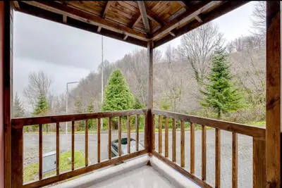 a screened in porch with a view of christmas trees at Villa Sapanca in Sapanca