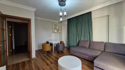 a living room with a couch and a table at Sabina gokcene 5 dk in Istanbul