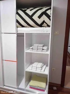a white closet with white towels in it at Sabina gokcene 5 dk in Istanbul