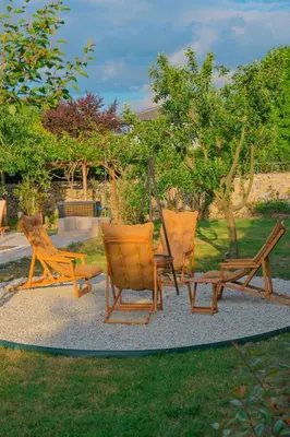 a group of chairs sitting in the grass at Kiwii Sapanca in Sapanca