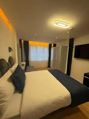 a bedroom with a large white bed in a room at Nest Ortaköy in Istanbul