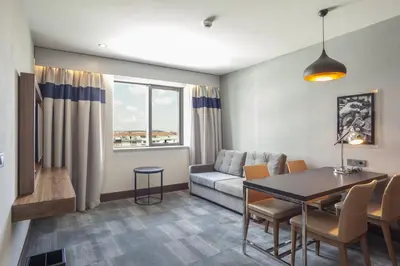 a living room with a couch and a table at Bof Hotels Business in Istanbul