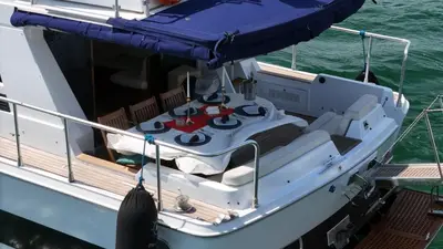 a small white boat with a canopy on the water at Pruva Yacht in Istanbul