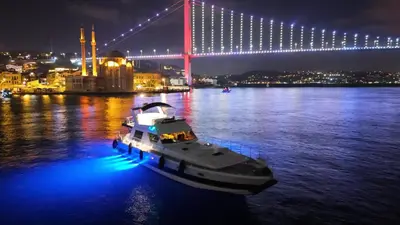 a boat in the water in front of a bridge at Pruva Yacht in Istanbul
