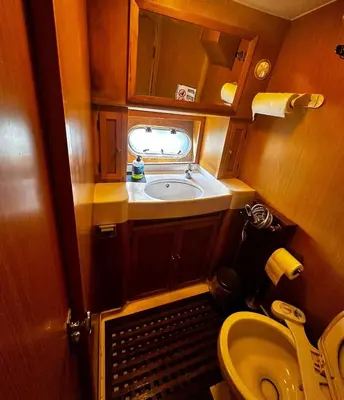a small bathroom with a sink and a toilet at Pruva Yacht in Istanbul