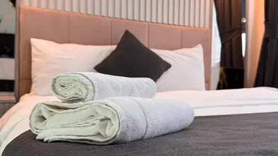 a pile of towels sitting on top of a bed at Mar Blanco Hotel in Istanbul