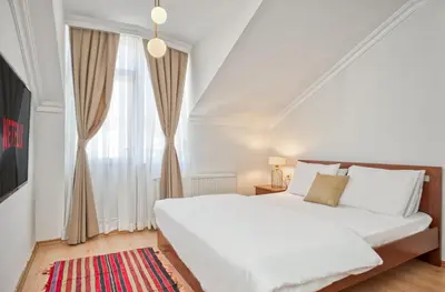 a bedroom with a white bed and a window at Dublex 3 Bedrooms&2Bathrooms &Terrace in Istanbul