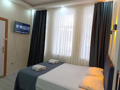 a bedroom with a bed with two towels on it at King Mas Suit in Istanbul