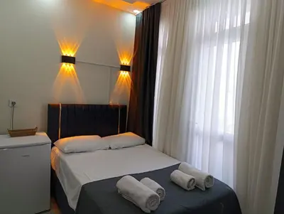 a bedroom with a bed with towels on it at King Mas Suit in Istanbul