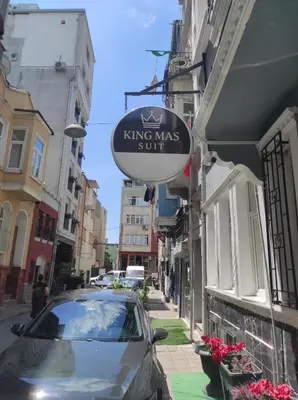 a sign forking mas stuff on the side of a street at King Mas Suit in Istanbul