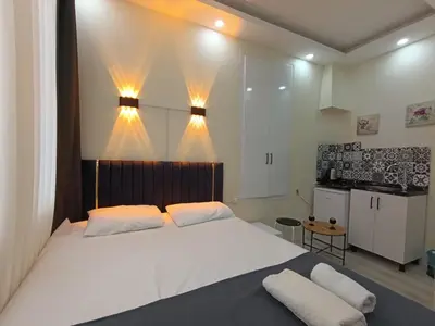 a bedroom with a large white bed with two pillows at King Mas Suit in Istanbul