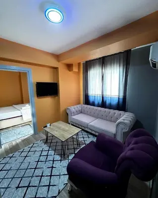 a living room with a couch and a table at İstanbulhome in Istanbul