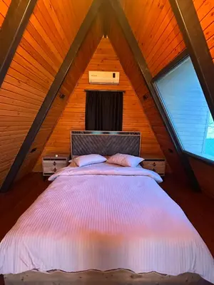a bedroom with a bed in a attic at Gölköy Bungalov Kandıra in Kandıra