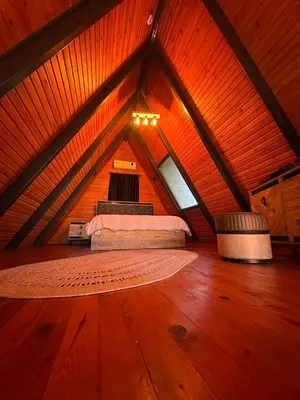 a room with a bed in a attic at Gölköy Bungalov Kandıra in Kandıra
