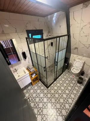 an overhead view of a bathroom with a shower and a toilet at Gölköy Bungalov Kandıra in Kandıra