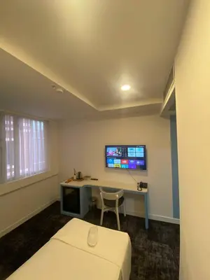a room with a bed and a desk and a tv at No25 Hotels in Corlu