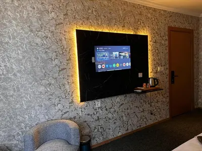 a tv on the wall of a hotel room at MAHAL Otel PENDİK in Istanbul