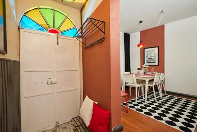 a room with a door and a dining room with a table at Private House near Taksim in Istanbul
